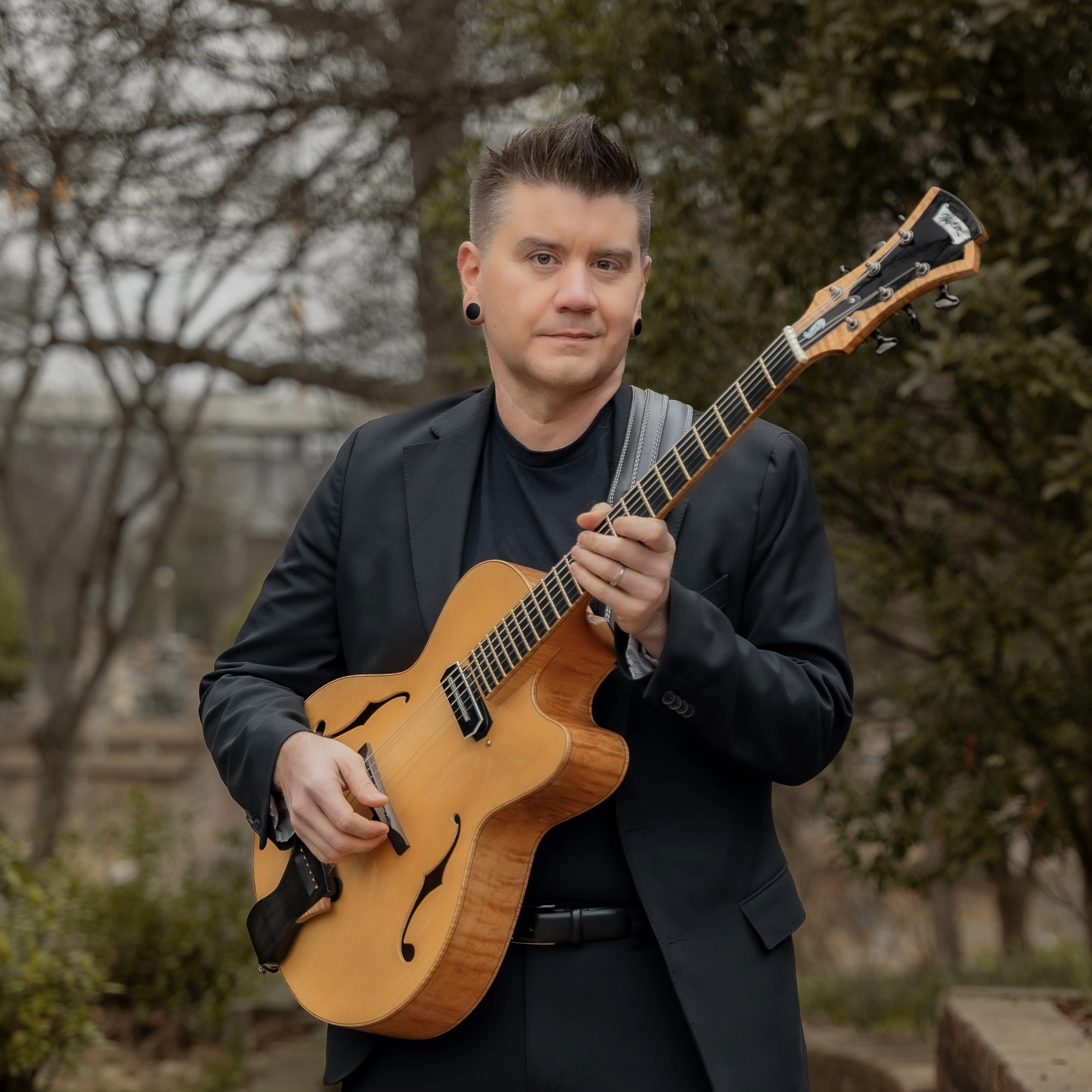 Micah Cadwell playing guitar