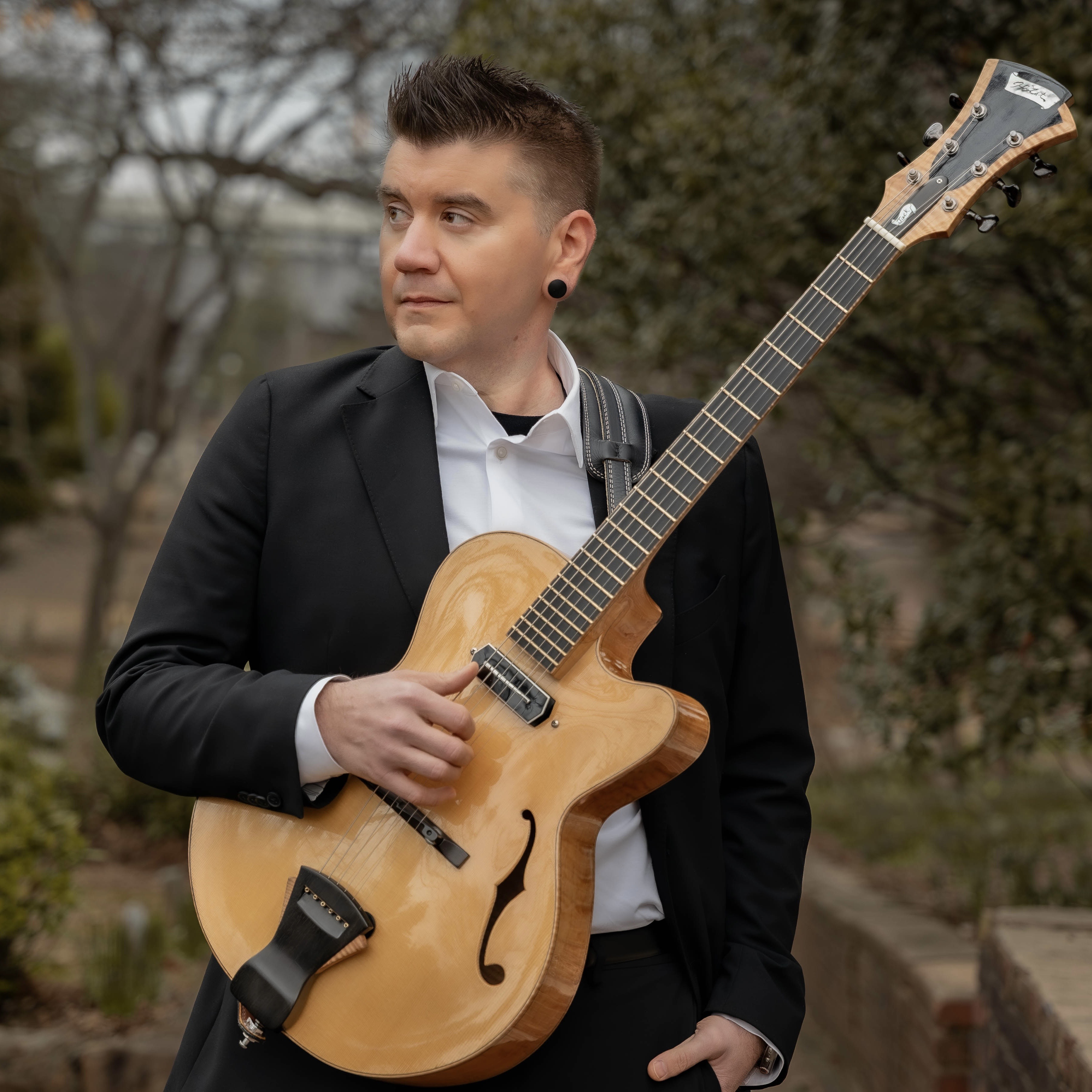 Micah Cadwell with guitar